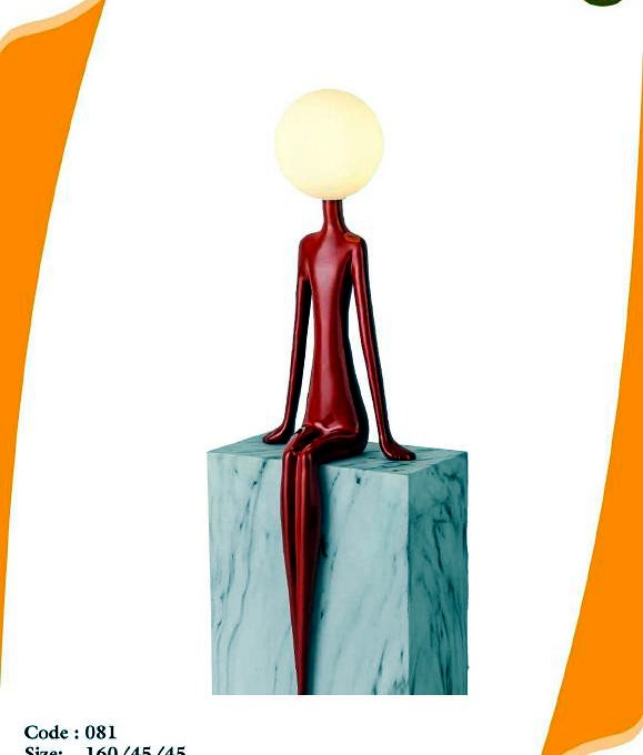 Seated silhouette, luminous orb